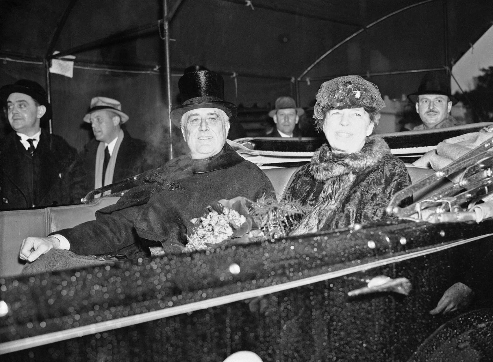 President Franklin D. Roosevelt and first lady Eleanor Roosevelt are seen up Pennsylvania Avenue during the inaugural parade in Washington, Jan. 4, 1937.  This will be Roosevelt's second term in office. (AP Photo)