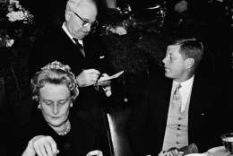 Former President Harry Truman autographs the inaugural luncheon program of President John F. Kennedy at the request of the new President in Washington, January 20, 1961. At left is Mrs. John Sparkman, wife of the Alabama senator. (AP Photo)