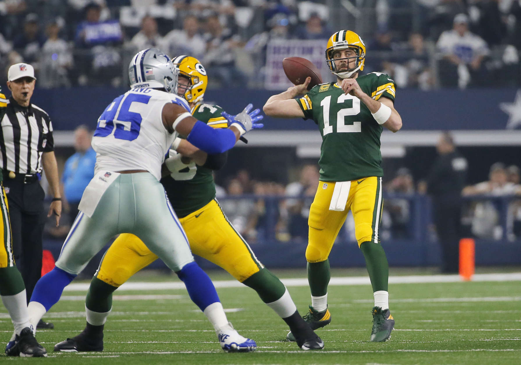 Green Bay Packers' Aaron Rodgers throws during the first half of an NFL divisional playoff football game against the Dallas Cowboys Sunday, Jan. 15, 2017, in Arlington, Texas. (AP Photo/Tony Gutierrez)
