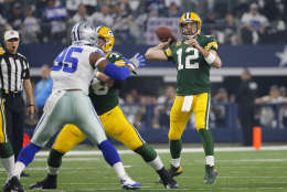 Green Bay Packers' Aaron Rodgers throws during the first half of an NFL divisional playoff football game against the Dallas Cowboys Sunday, Jan. 15, 2017, in Arlington, Texas. (AP Photo/Tony Gutierrez)