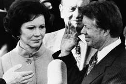 Rosalynn Carter, left, looks up at her husband Jimmy Carter as he takes the oath of office as the 39th President of the United States at the Capitol, Thursday, Jan. 20, 1977, Washington, D.C. Mrs. Carter held a family Bible for her husband. (AP Photo)