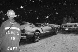 The remains of an auto that was hit by an Air Florida jetliner is shown on the 14th Street Bridge in Washington, Wednesday, Jan. 13, 1982. The jet was taking off from National Airport but hit some autos then crashed into the Potomac River. (AP Photo/Ira Schwarz)