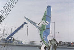 The tail section of the Boeing 727 that crashed into the Potomac River on Jan. 13 is lifted from the river in Washington on Jan. 18, 1982. (AP Photo/Barry Thumma)