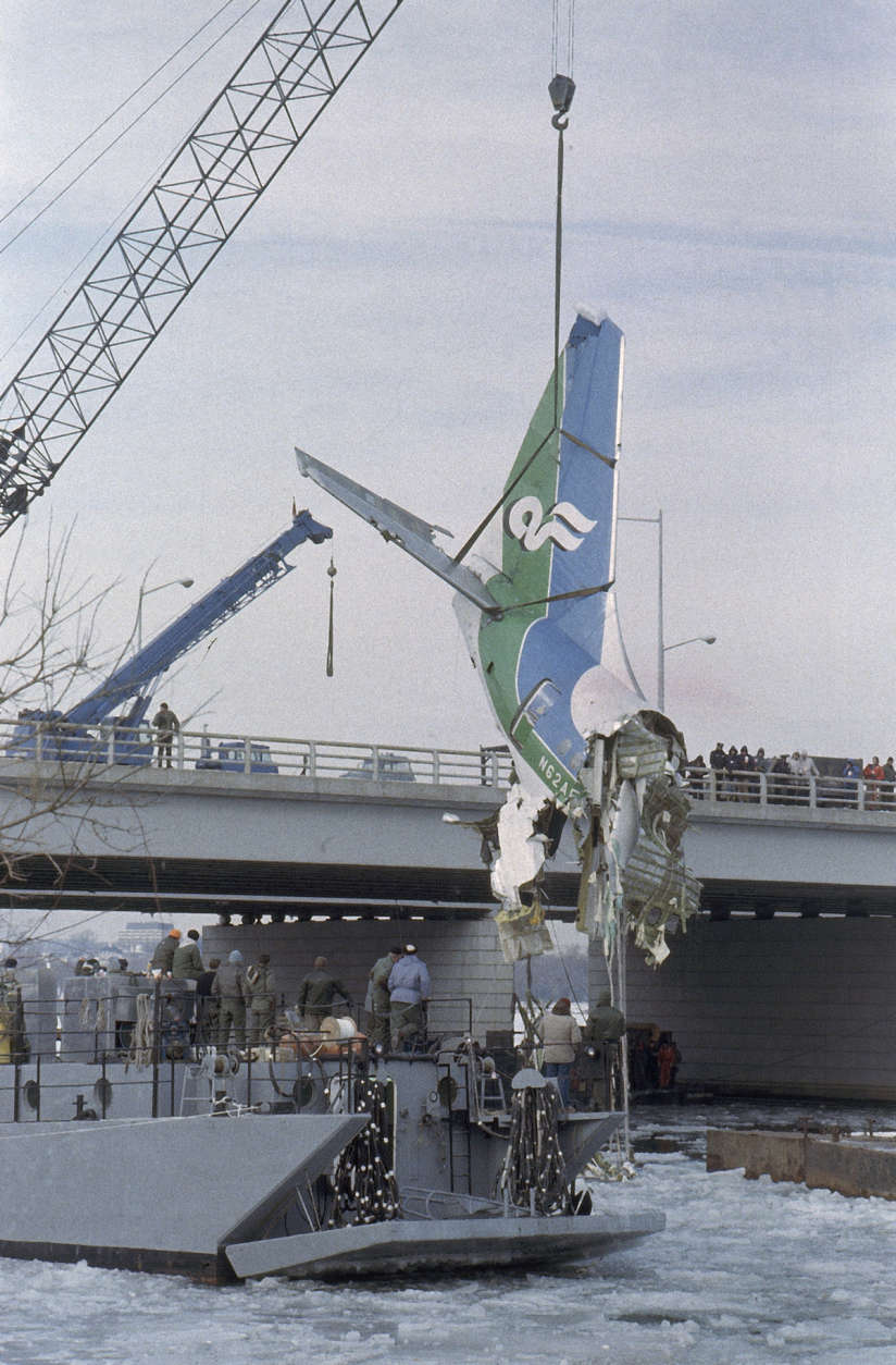 The tail section of the Boeing 727 that crashed into the Potomac River on Jan. 13 is lifted from the river in Washington on Jan. 18, 1982. (AP Photo/Barry Thumma)