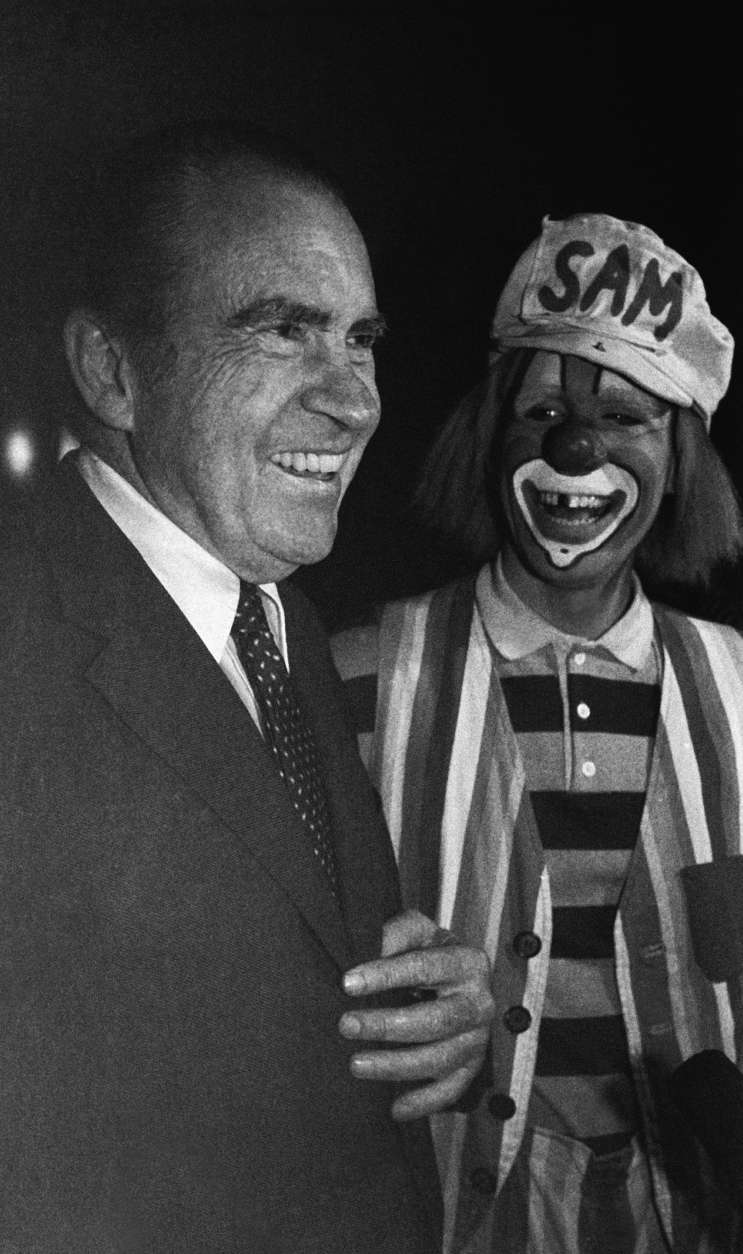 Former President Richard Nixon shares a laugh with "Sam" the clown from the Ringling Brothers and Barnum and Bailey Circus, at the Brendan Byrne Arena on Nov. 26, 1982 in East Rutherford, New Jersey. Nixon was at the circus with his grandchildren. (AP Photo/David Bookstaver)