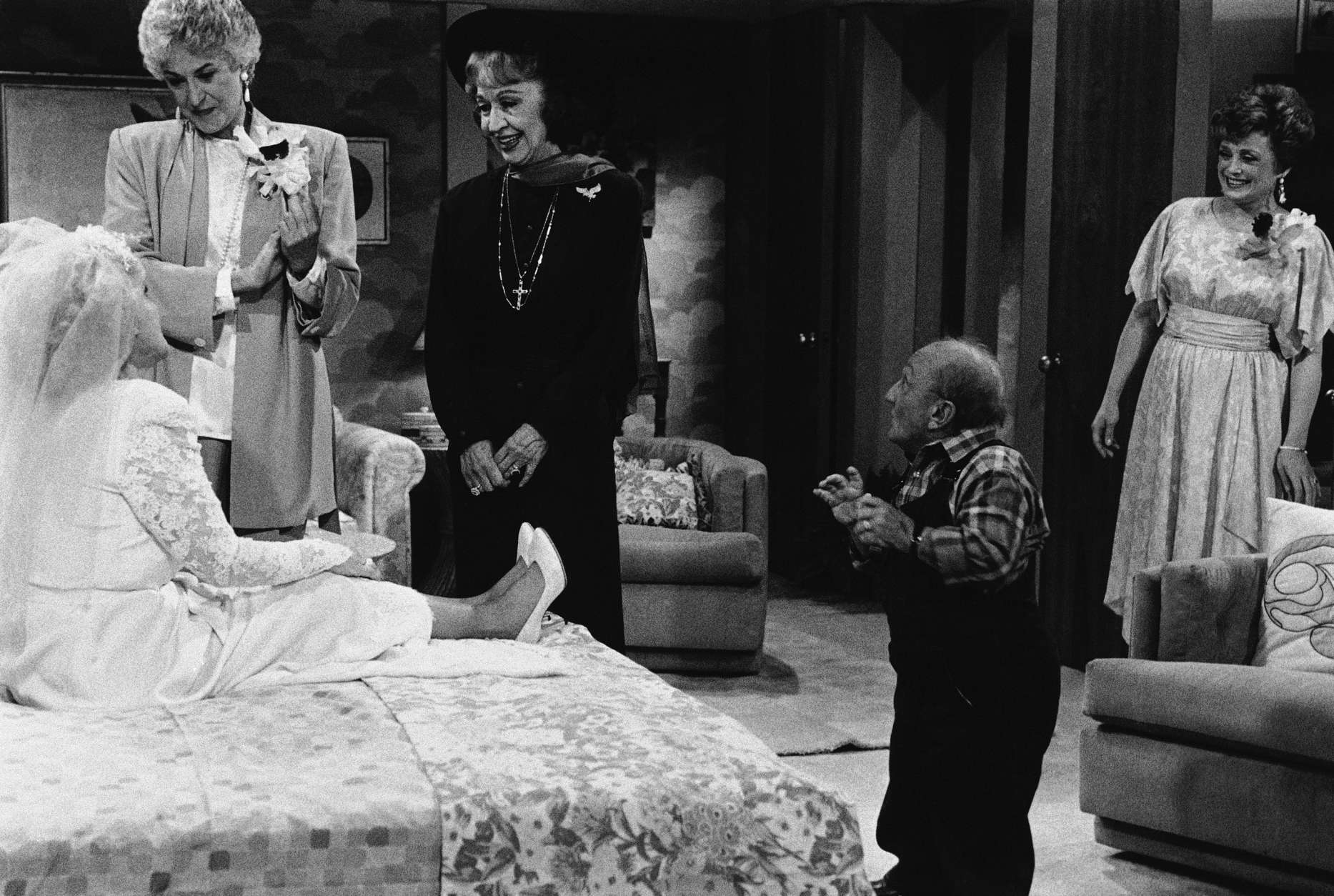 Astrologer Jeane Dixon plays herself of an upcoming episode of ?The Golden Girls? on NBC on Saturday, Dec. 14, 1985. Pictured during the taping of the show, in which she appears during a dream sequence, are: (left to right)- Betty White (Rose Nylund); Bea Arthur (Dorothy Zbornak); Dixon; Billy Barty (Hollywood?s most famous midget, who is playing Rose?s father in her dream) and Rue McClanahn (Blanche DuBois). (AP Photo)