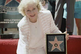 Comedienne Betty White places her hand on the star that was presented posthumously to her husband, Allen Ludden, during ceremonies inducting him into the Hollywood Walk of Fame in Hollywood, Los Angeles, Thursday, March 31, 1988. Ludden was honored with the 1,868th star of the famed walkway ? between those of White and Tyrone Power. (AP Photo/Nick Ut)