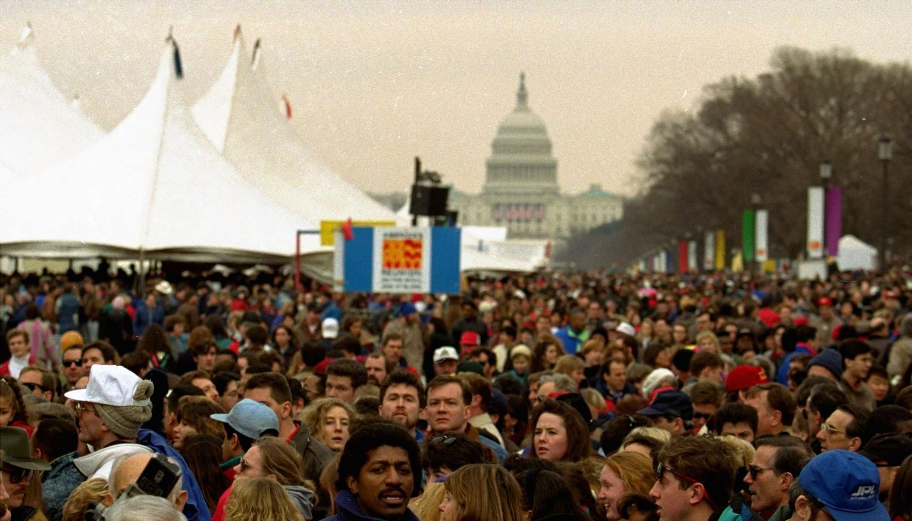 Thousands gather on the Mall Sunday to take in "America's Reunion on the Mall", a free festival of arts, crafts and music that opens Bill Clinton's five-day inaugural celebration.  The Capitol is in the background.  (AP Photo/Mark Wilson)