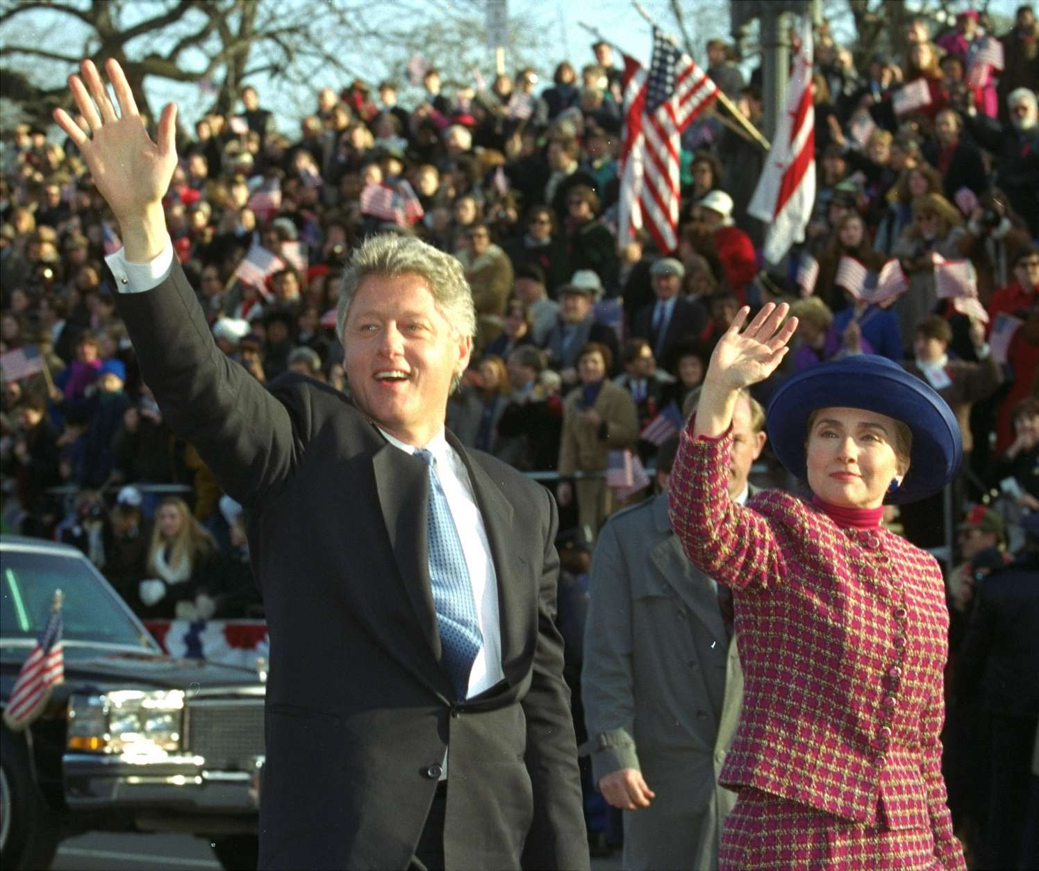 President and Mrs. Clinton wave as they walk down Pennsylvania Avenue in Washington Wednesday, January 20, 1993 during the presidential inaugural parade.  (AP Photo/Doug Mills)