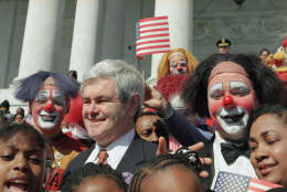 An American flag is held over the head of House Speaker Newt Gingrich of Ga., during a Capitol Hill performance of the Ringling Brothers and Barnum and bailey circus, Wednesday, April 5, 1995 in Washington. The circus played Capitol Hill to mark its 125th anniversary and the final week to House votes on the Republicans Contract with America. (AP Photo/Joe Marquette)