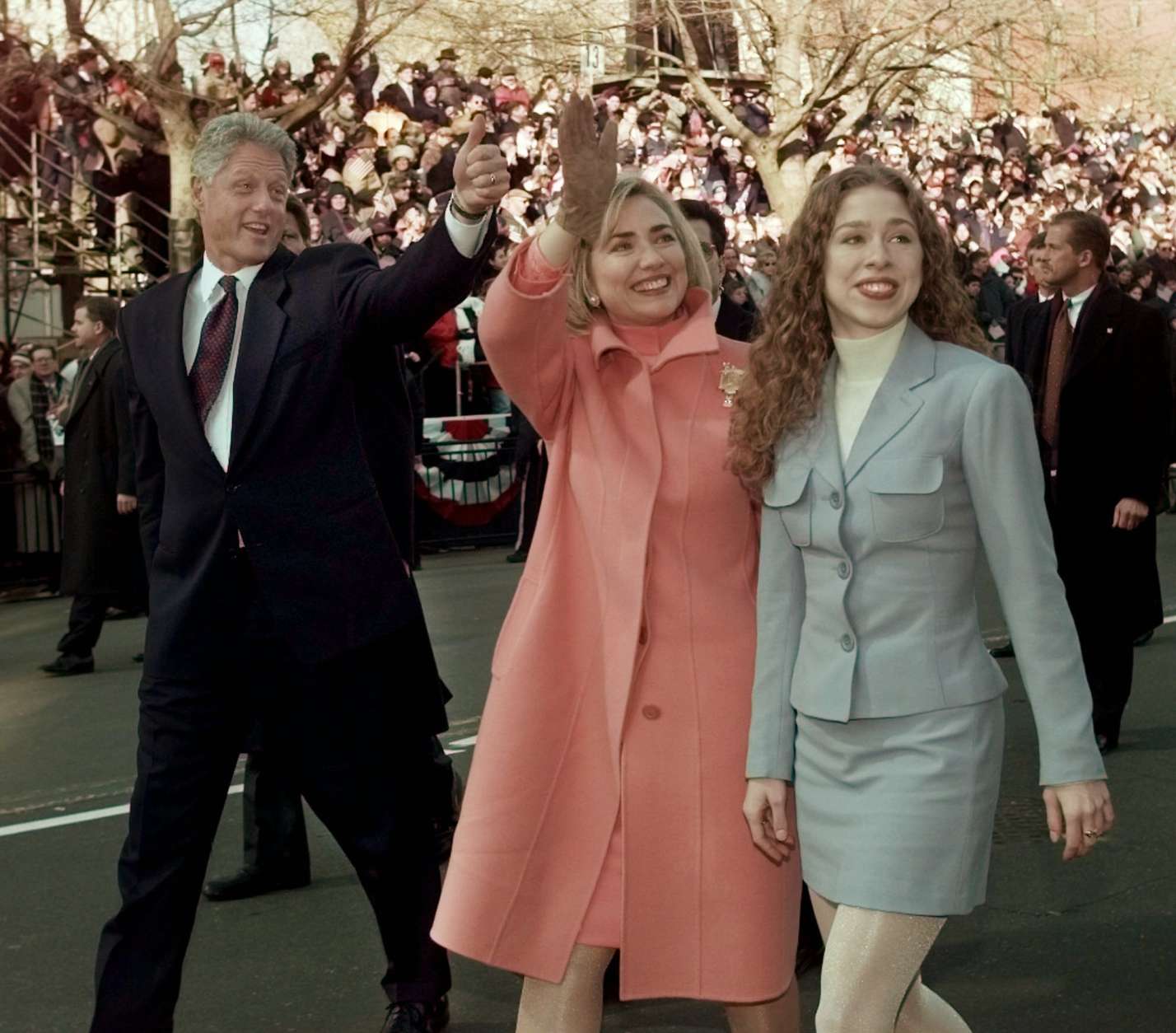 President Clinton, Mrs. Clinton and daughter Chelsea wave as they walk down Pennsylvania Avenue Monday Jan. 20, 1997 to start the presidential inaugural parade. (AP Photo/Greg Gibson)