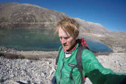 Burch next to a high altitude glacier lake showing signs of evaporation. (Courtesy: Sean Burch)