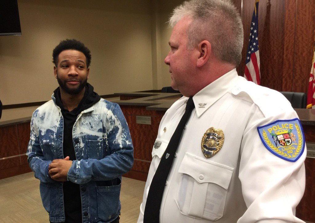 Brandon Roberson chats with Laurel Police Chief Richard McLaughlin following the announcemnet that an arrest had been made in the 2005 murder of Roberson's  uncle, Brian Moses.