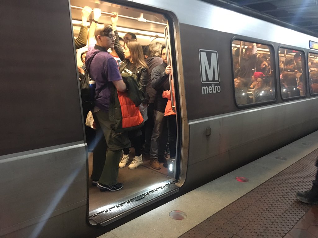 Crowds pack a Blue Line train headed toward the Women's March on Washington on Saturday, Jan. 21, 2017. Transit officials say ridership topped 1 million, setting a record. (WTOP/Max Smith) 