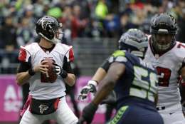 Atlanta Falcons quarterback Matt Ryan looks to pass against the Seattle Seahawks in the first half of an NFL football game, Sunday, Oct. 16, 2016, in Seattle. (AP Photo/Elaine Thompson)