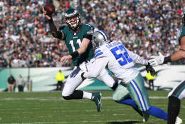 PHILADELPHIA, PA - JANUARY 01: Carson Wentz #11 of the Philadelphia Eagles looks to pass as Andrew Gachkar #52 of the Dallas Cowboys pursues during the first quarter of a game at Lincoln Financial Field on January 1, 2017 in Philadelphia, Pennsylvania. (Photo by Rich Schultz/Getty Images)