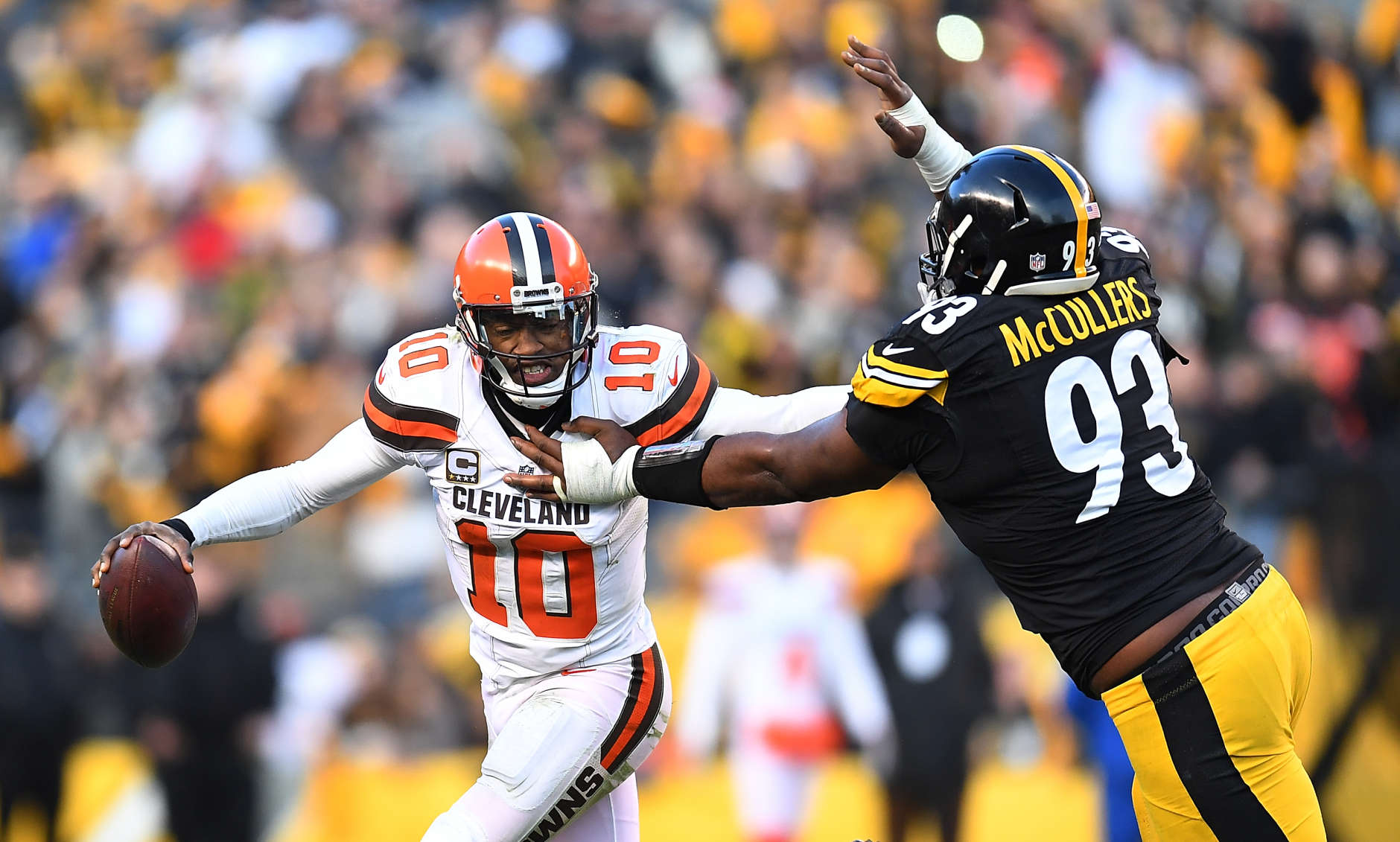 PITTSBURGH, PA - JANUARY 01:  Robert Griffin III #10 of the Cleveland Browns tries to avoid the oncoming rush of Dan McCullers-Sanders #93 of the Pittsburgh Steelers in the overtime period during the game at Heinz Field on January 1, 2017 in Pittsburgh, Pennsylvania. (Photo by Joe Sargent/Getty Images)