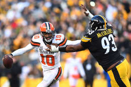 PITTSBURGH, PA - JANUARY 01:  Robert Griffin III #10 of the Cleveland Browns tries to avoid the oncoming rush of Dan McCullers-Sanders #93 of the Pittsburgh Steelers in the overtime period during the game at Heinz Field on January 1, 2017 in Pittsburgh, Pennsylvania. (Photo by Joe Sargent/Getty Images)