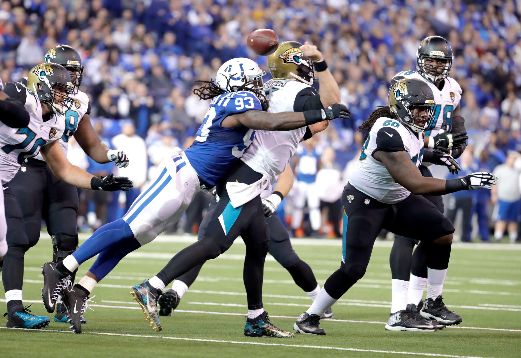 INDIANAPOLIS, IN - JANUARY 01:  Blake Bortles #5 of the Jacksonville Jaguars fumbles the ball as he is hit by Erik Walden #93 of the Indianapolis Colts  during the game at Lucas Oil Stadium on January 1, 2017 in Indianapolis, Indiana.  (Photo by Andy Lyons/Getty Images)