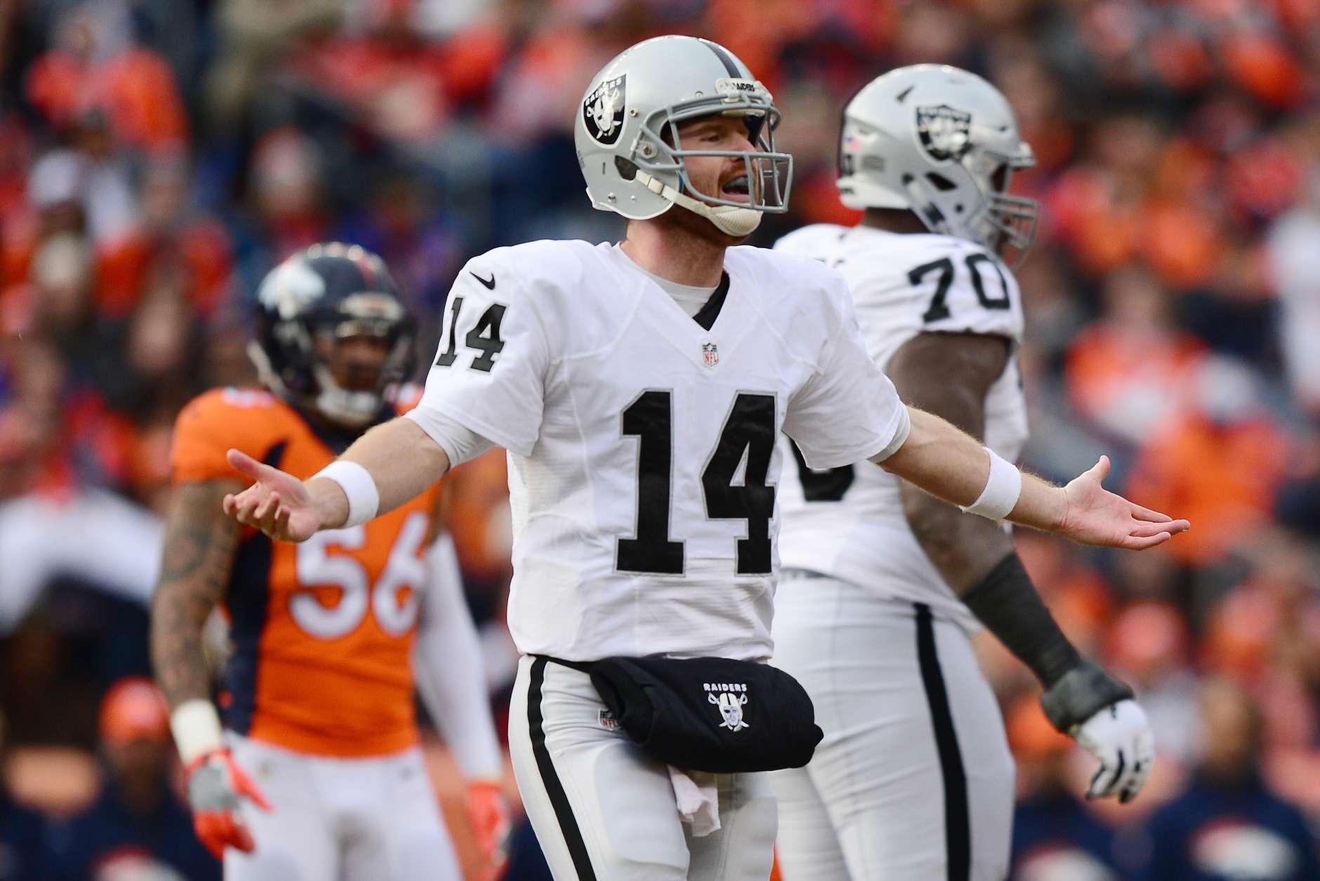 DENVER, CO - JANUARY 1:  Quarterback Matt McGloin #14 of the Oakland Raiders with his arms outstretched in the first quarter of the game against the Denver Broncos at Sports Authority Field at Mile High on January 1, 2017 in Denver, Colorado. (Photo by Dustin Bradford/Getty Images)
