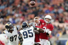 LOS ANGELES, CA - JANUARY 01:  Quarterback Carson Palmer #3 of the Arizona Cardinals throws a pass in the fourth quarter over defensive end William Hayes #95 of the Los Angeles Rams at Los Angeles Memorial Coliseum on January 1, 2017 in Los Angeles, California.  (Photo by Stephen Dunn/Getty Images)