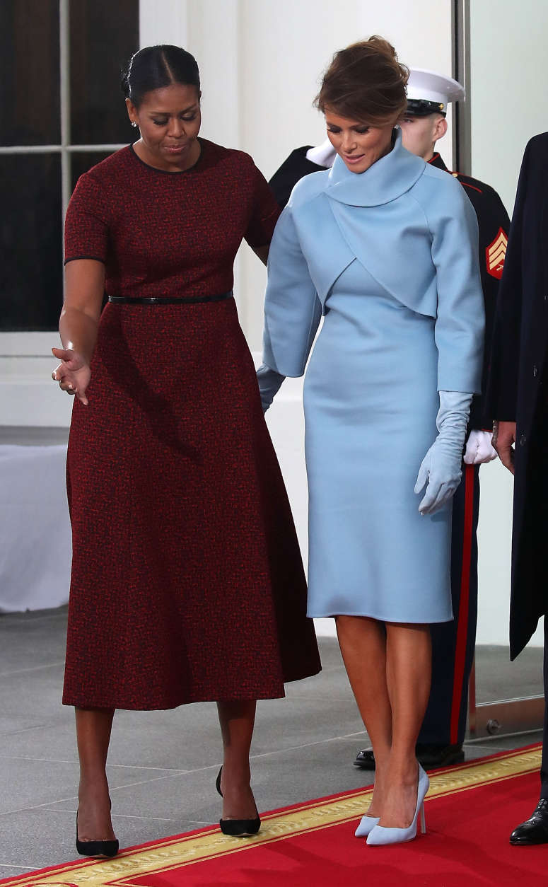 WASHINGTON, DC - JANUARY 20: First lady Michelle Obama (L), greets Melania Trump after she and her husband president-elect Donald Trump arrived at the White House on January 20, 2017 in Washington, DC. Later in the morning President-elect Trump will be sworn in as the nation's 45th president during an inaugural ceremony at the U.S. Capitol. (Photo by Mark Wilson/Getty Images)
