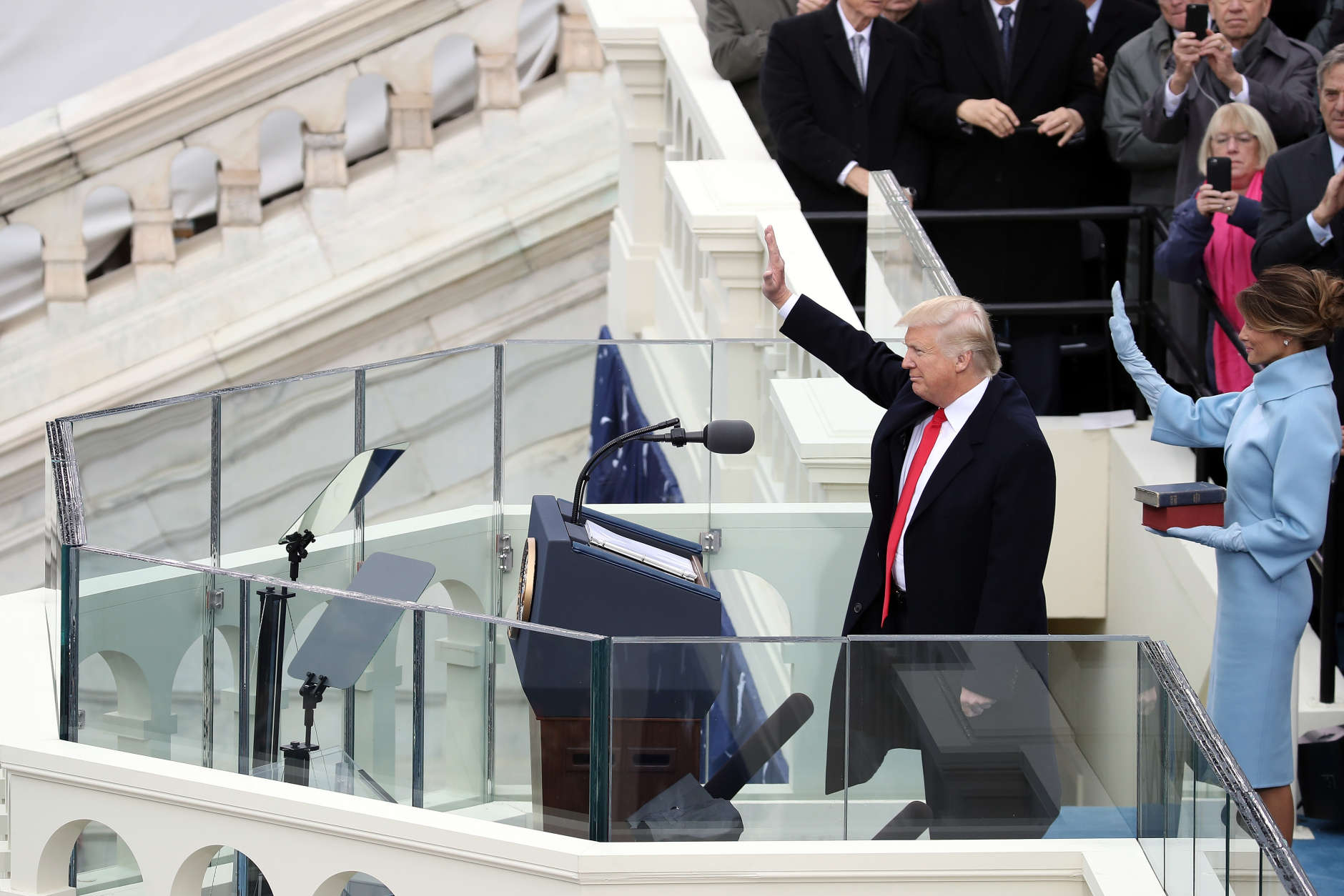 WASHINGTON, DC - JANUARY 20:  U.S. President Donald Trump and his wife Melania Trump wave after he took the oath of office on the West Front of the U.S. Capitol on January 20, 2017 in Washington, DC. In today's inauguration ceremony Donald J. Trump becomes the 45th president of the United States.  (Photo by Drew Angerer/Getty Images)