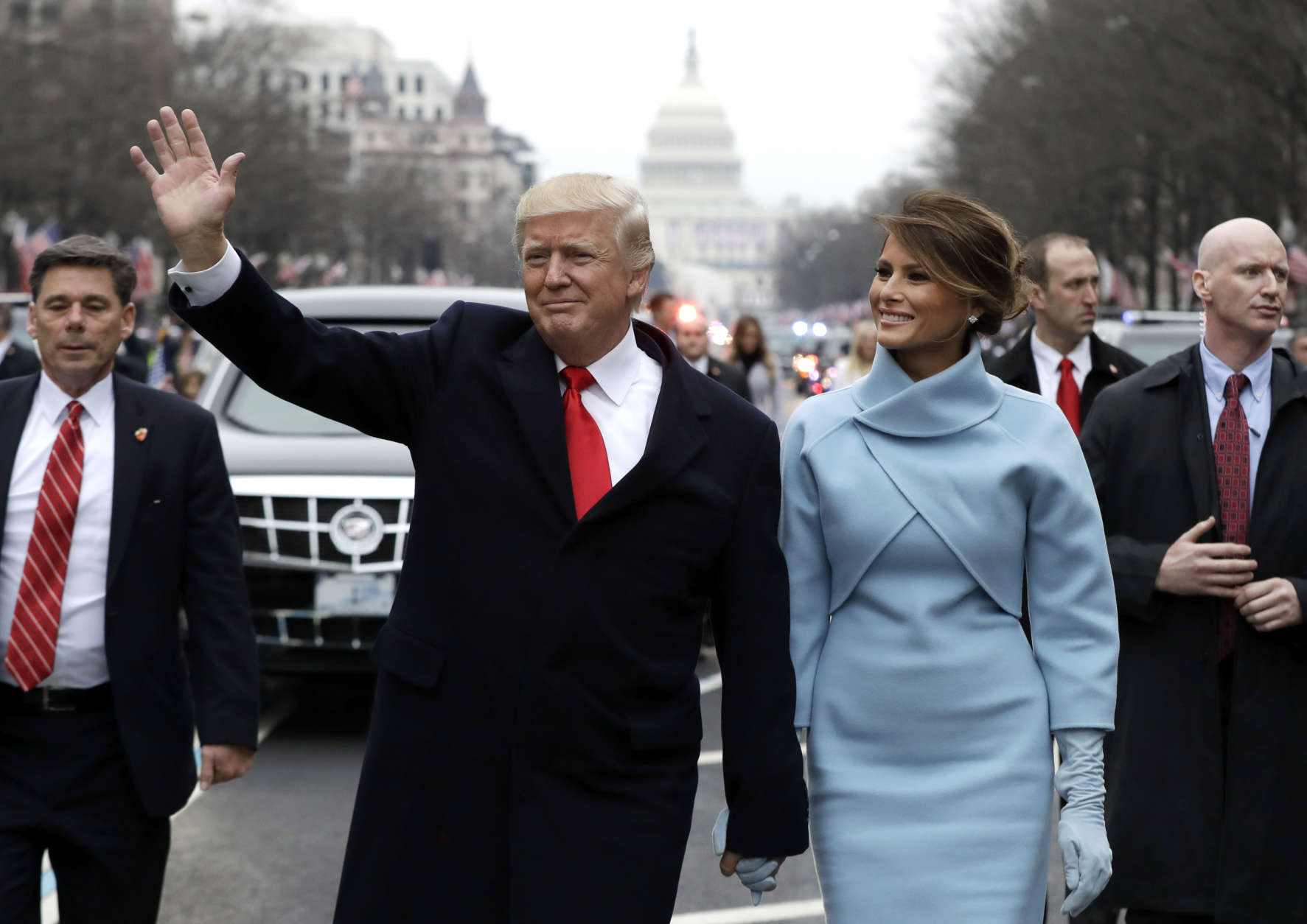 WASHINGTON, DC - JANUARY 20:  U.S. President Donald Trump waves to supporters as he walks the parade route with first lady Melania Trump after being sworn in at the 58th Presidential Inauguration January 20, 2017 in Washington, D.C. Donald J. Trump was sworn in today as the 45th president of the United States  (Photo by Evan Vucci - Pool/Getty Images)
