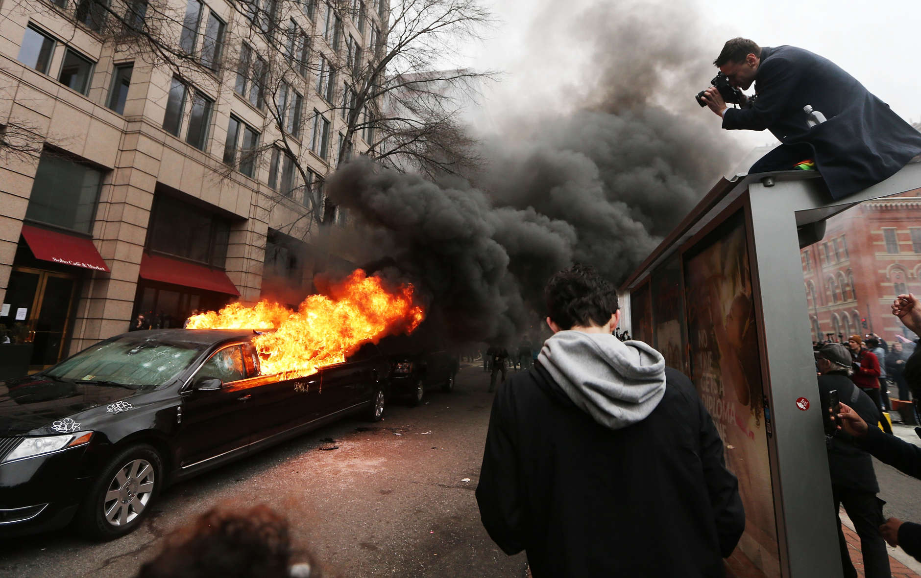 WASHINGTON, DC - JANUARY 20:  A limousine burns after being smashed by anti-Trump protesters on K Street on January 20, 2017 in Washington, DC. While protests were mostly peaceful, some turned violent. President-elect Donald Trump was sworn-in as the 45th U.S. President today.  (Photo by Mario Tama/Getty Images)