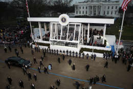 WASHINGTON, DC - JANUARY 20:  U.S. President Donald Trump waves to supporters as he walks the parade route with first lady Melania Trump and son Barron Trump past the main reviewing stand in front of the White House during the Inaugural Parade on January 20, 2017 in Washington, DC. Donald J. Trump was sworn in today as the 45th president of the United States.  (Photo by Joe Raedle/Getty Images)