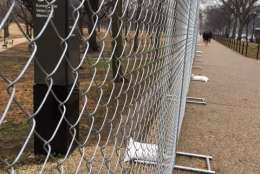 Fencing, like this seen near 19th Street and Constitution Avenue in D.C. on Saturday, Jan. 14, 2017, has begun to appear in areas around the National Mall in advance of Inauguration Day. (WTOP/Jenny Glick)