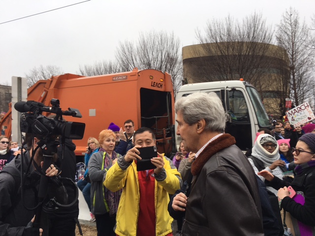 Former Secretary of State John Kerry walks through the crowd at the Women's March on Washington in D.C. on Saturday, Jan. 21, 2017. (WTOP/Jenny Glick)