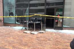The window of a Starbucks was broken at 13th and I streets in northwest Washington. (WTOP/Dennis Foley)