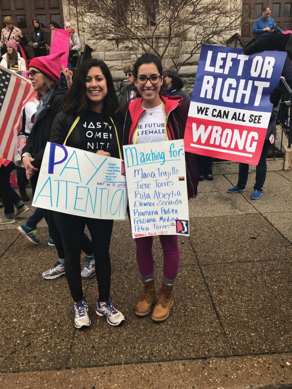 Two D.C. residents proudly display their signs as they prepare for the Women's March on Washington in D.C. on Saturday morning, Jan. 21, 2017. (Courtesy Valerie Echeveste)