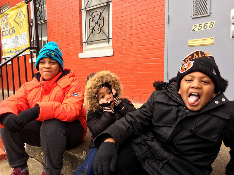 The Edmonds and Watson families await the start of the 11th annual Dr. Martin Luther King, Jr. Parade in Washington, D.C. on Monday, Jan. 16, 2017. (WTOP/Kristi King)
