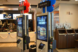 This handout photo from McDonald's DC shows new kiosk ordering screens inside the redesigned restaurant at 2228 New York Avenue NE in D.C. The fast food chain is rolling out its "Experience the Future" restaurants in the region. Twenty-five of the redsigned restaurants will be open by late spring. (Courtesy McDonald's DC)