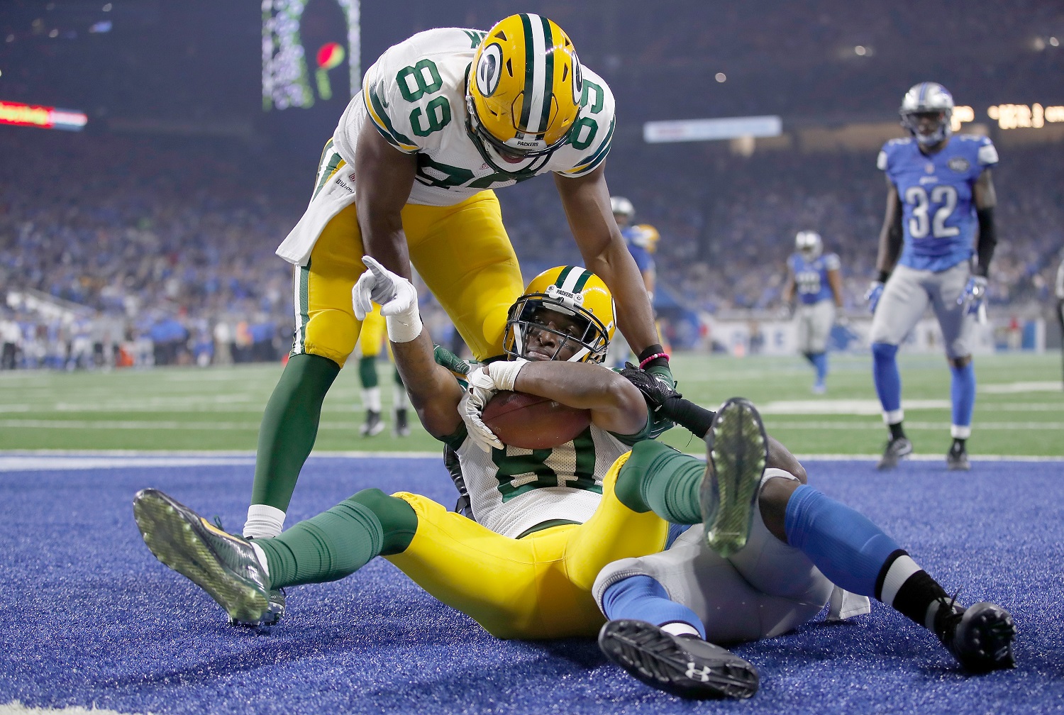 DETROIT, MI - JANUARY 1: Geronimo Allison #81 of the Green Bay Packers celebrates his touchdown catch with teammate Jared Cook #89 against the Detroit Lions during fourth quarter at Ford Field on January 1, 2017 in Detroit, Michigan (Photo by Gregory Shamus/Getty Images)