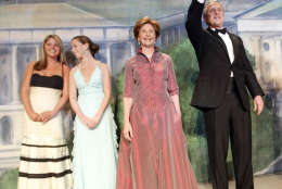 President Bush, right, first lady Laura Bush and their twin daughters Barbara (far left) and Jenna (to her right) are introduced at the Texas State Society's Black Tie and Boots Ball the week's first inaugural gala Wednesday, Jan. 19, 2005 in Washington. (AP Photo/Pablo Martinez Monsivais)
