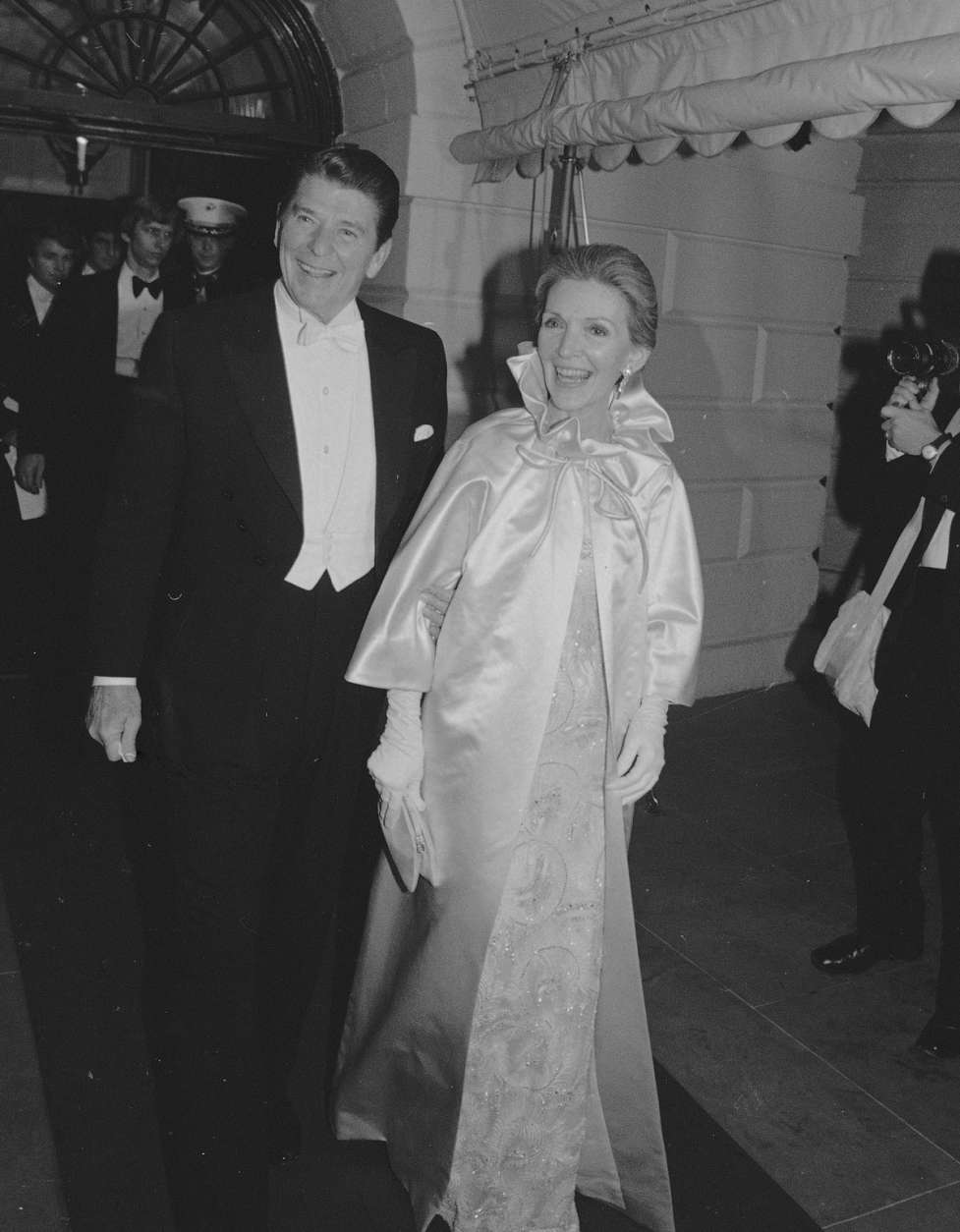 Pres. Ronald Reagan and first lady Nancy Reagan leave the White House to attend the first of several inaugural balls in Washington, Jan. 20, 1981. (AP Photo)