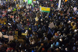 Protesters assemble at John F. Kennedy International Airport in New York, Saturday, Jan. 28, 2017, after earlier in the day two Iraqi refugees were detained while trying to enter the country. On Friday, Jan. 27, President Donald Trump signed an executive order suspending all immigration from countries with terrorism concerns for 90 days. Countries included in the ban are Iraq, Syria, Iran, Sudan, Libya, Somalia and Yemen, which are all Muslim-majority nations. (AP Photo/Craig Ruttle)