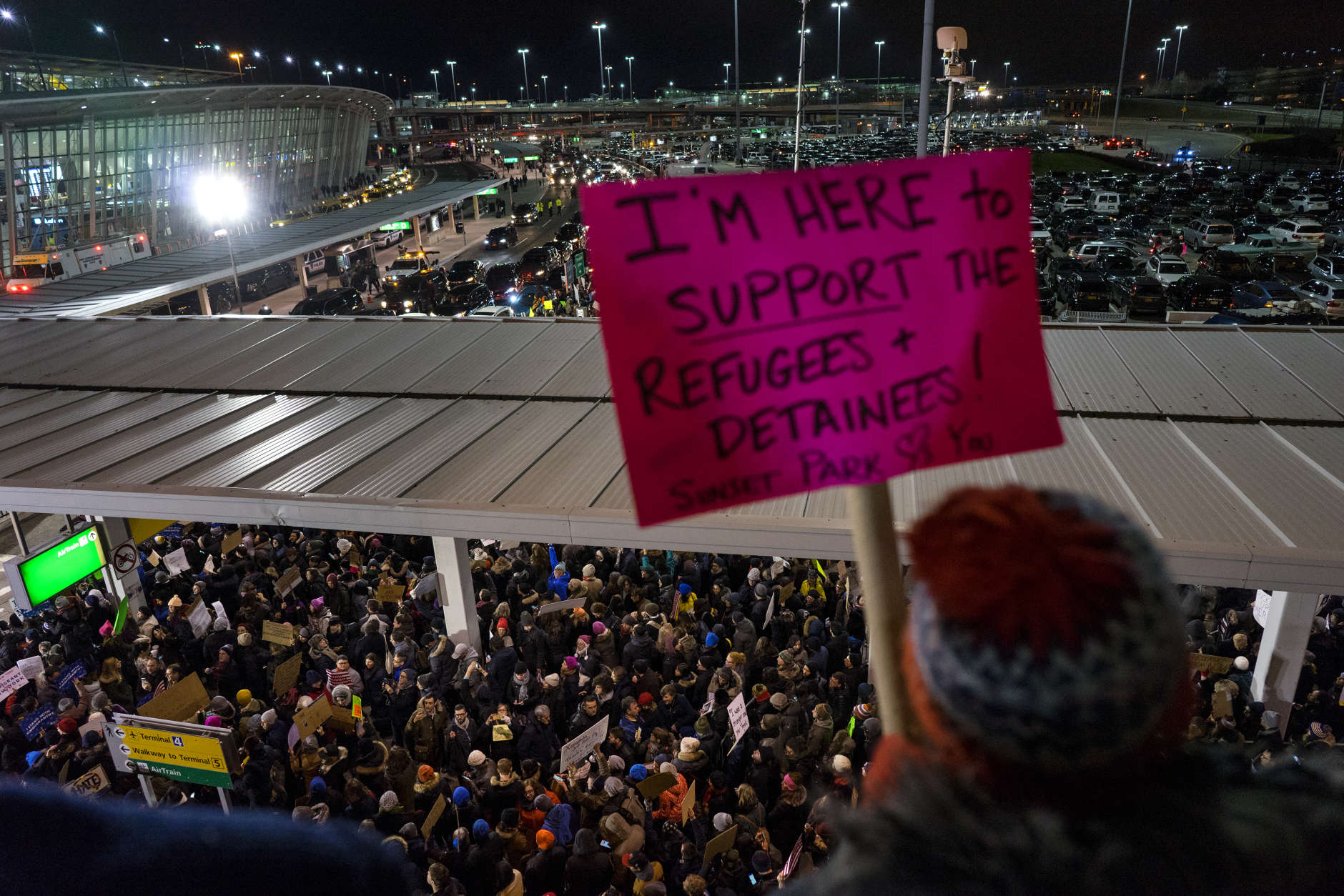 Protesters assemble at John F. Kennedy International Airport in New York, Saturday, Jan. 28, 2017 after earlier in the day two Iraqi refugees were detained while trying to enter the country. On Friday, Jan. 27, President Donald Trump signed an executive order suspending all immigration from countries with terrorism concerns for 90 days. Countries included in the ban are Iraq, Syria, Iran, Sudan, Libya, Somalia and Yemen, which are all Muslim-majority nations. (AP Photo/Craig Ruttle)