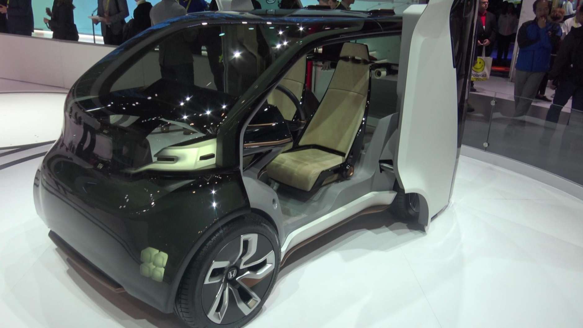 Honda has incorporated both concepts into NeuV, a self-driving, two-seat commuter car for urban environments powered by an Emotion Engine that learns by detecting the emotions behind the driver's judgments and then, based on the driver's past decisions, makes new choices and recommendations. (WTOP/Kenny Fried)