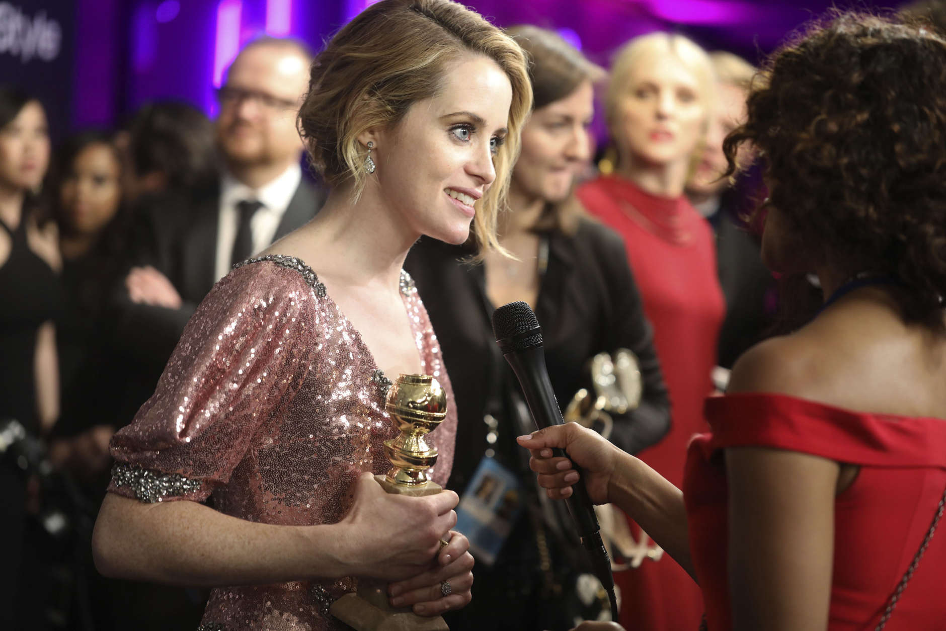 Claire Foy is interviewed as she arrives at the InStyle and Warner Bros. Golden Globes afterparty at the Beverly Hilton Hotel on Sunday, Jan. 8, 2017, in Beverly Hills, Calif. (Photo by Matt Sayles/Invision/AP)
