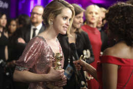 Claire Foy is interviewed as she arrives at the InStyle and Warner Bros. Golden Globes afterparty at the Beverly Hilton Hotel on Sunday, Jan. 8, 2017, in Beverly Hills, Calif. (Photo by Matt Sayles/Invision/AP)