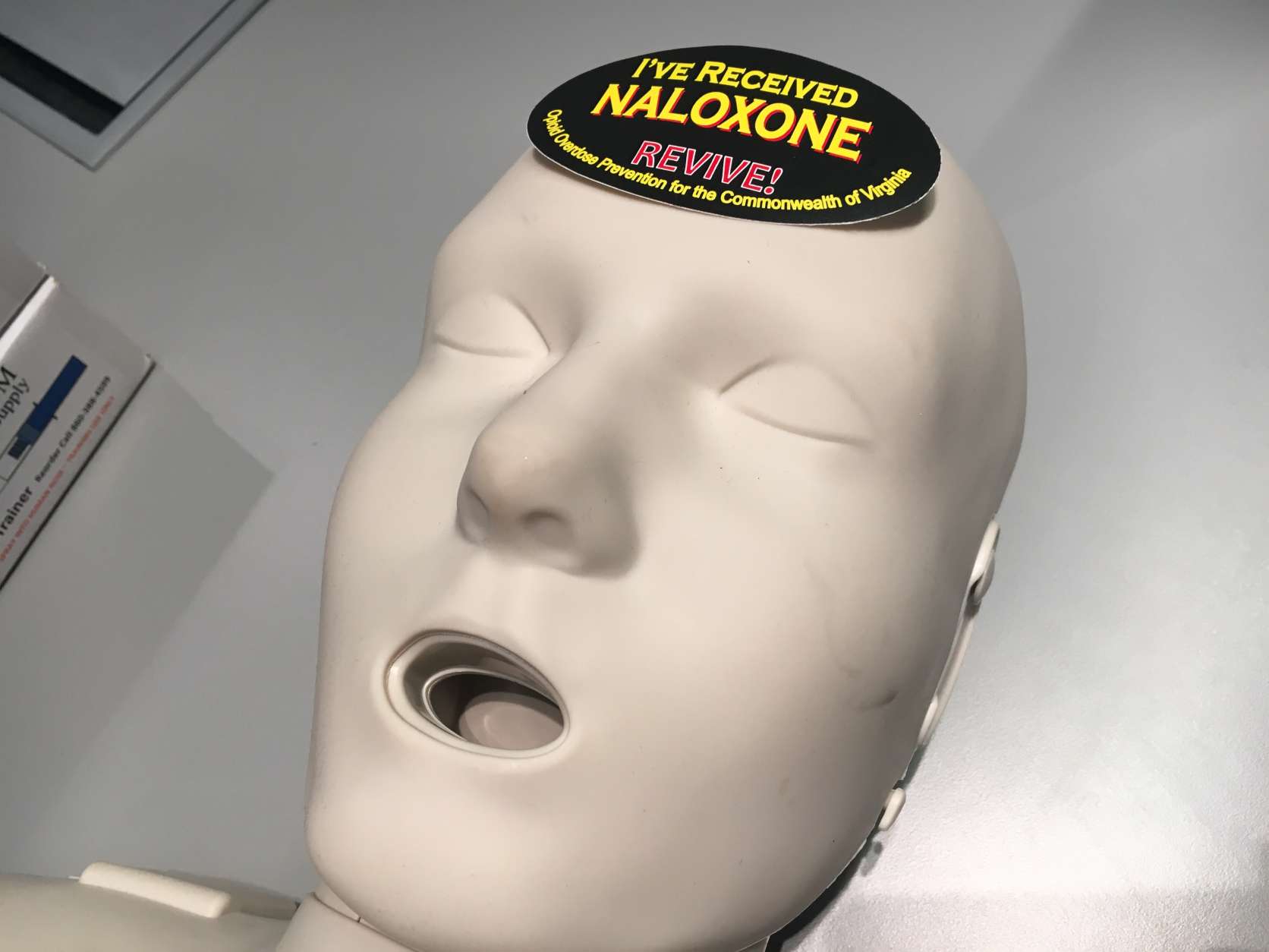 Naloxone stickers are included in the kits. When placed on a visible part of the victim's face, they inform medical professionals that a suspected opioid overdose occurred and the person was given naloxone. (WTOP/Jamie Forzato)