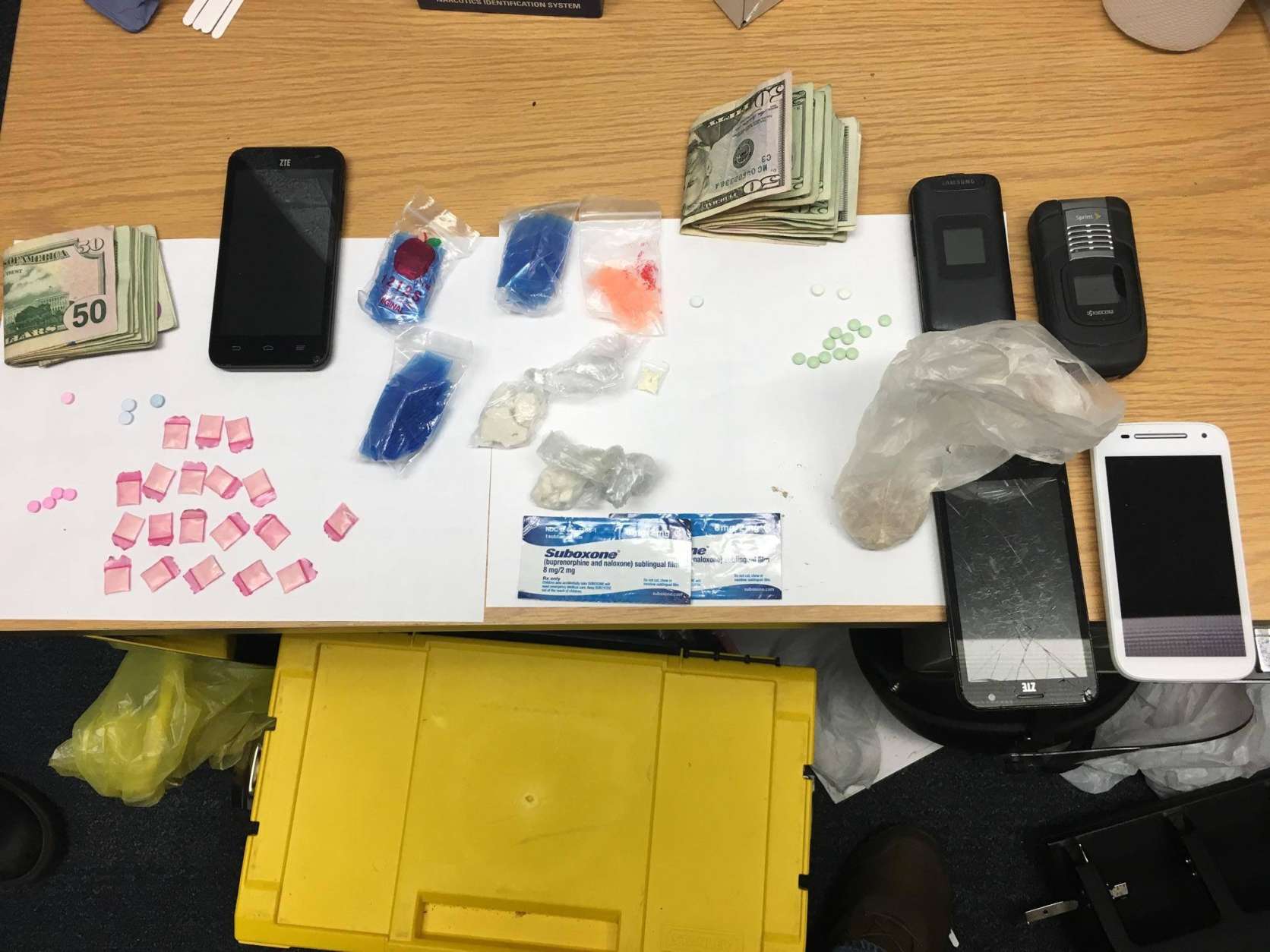Anne Arundel Detectives from the Northern District Tactical Narcotics Team executed a warrant for a Pasadena home in March 2016 after a narcotics trafficking investigation. Detectives seized more than 11 grams of cocaine, more than 6 grams of raw heroin, 19 baggies of heroin, 19 oxycodone tablets, 3 alprazolam tablets, 2 Suboxone strips and more than $500 cash. Two suspects were charged with possession with the intent to distribute. (Courtesy Anne Arundel County Police)