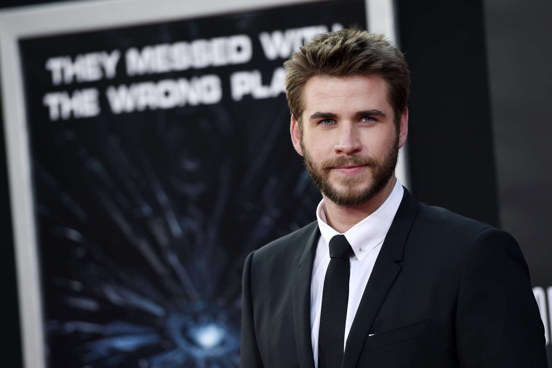 Liam Hemsworth, a cast member in "Independence Day: Resurgence," poses at the premiere of the film at the TCL Chinese Theatre on Monday, June 20, 2016, in Los Angeles. (Photo by Chris Pizzello/Invision/AP)
