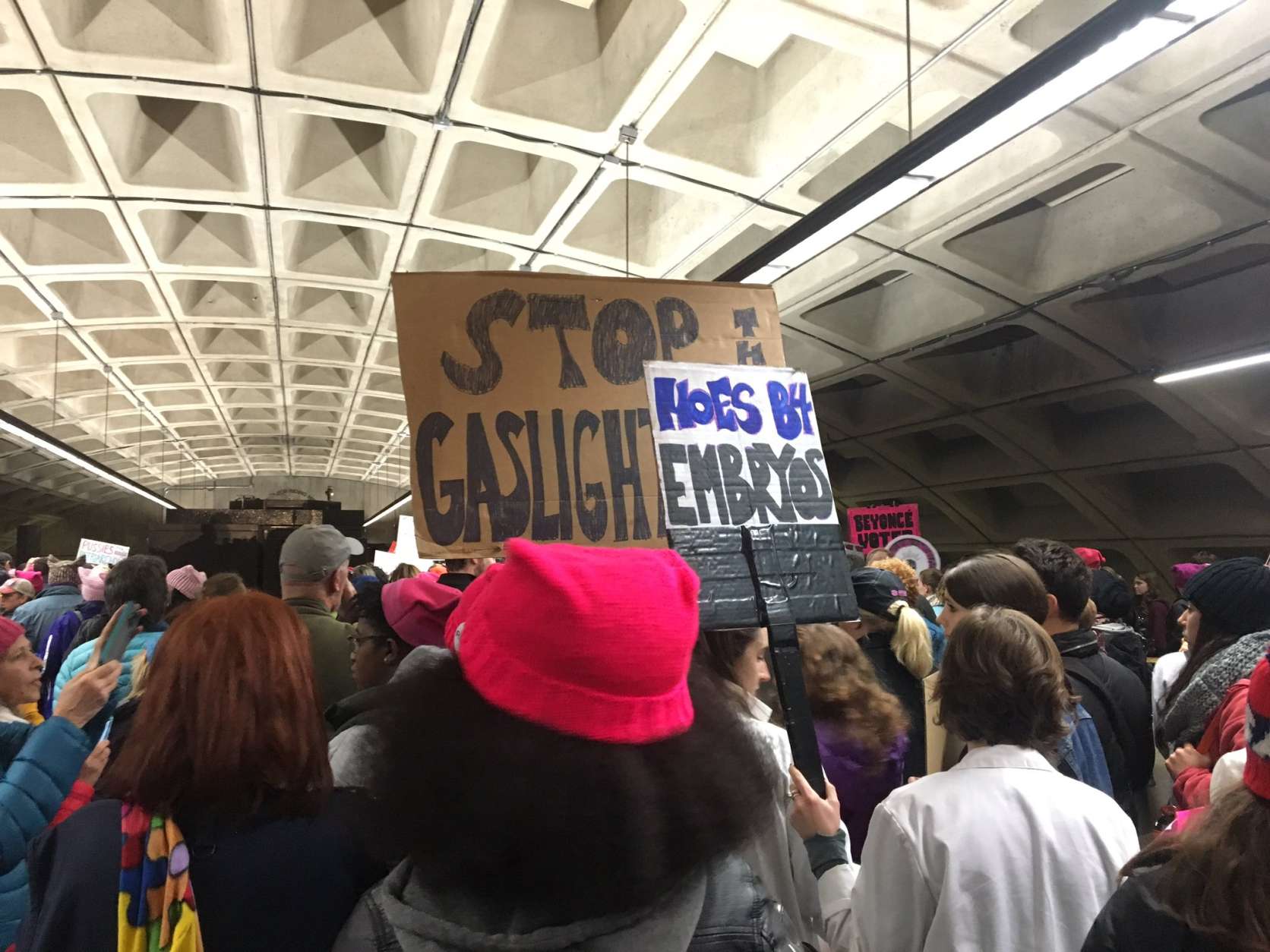 Chants of "Fired up, ready to go" were heard at L'Enfant station, sparking cheers among people headed toward the Women's March on Washington Saturday morning, Jan. 21, 2017. (WTOP/Max Smith)