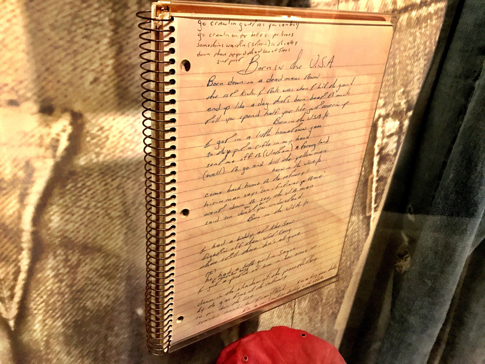 Bruce Springsteen's notebook, including "Born in the USA." The lyrics reflect the challenges of veterans returning from war. (WTOP/Neal Augenstein)