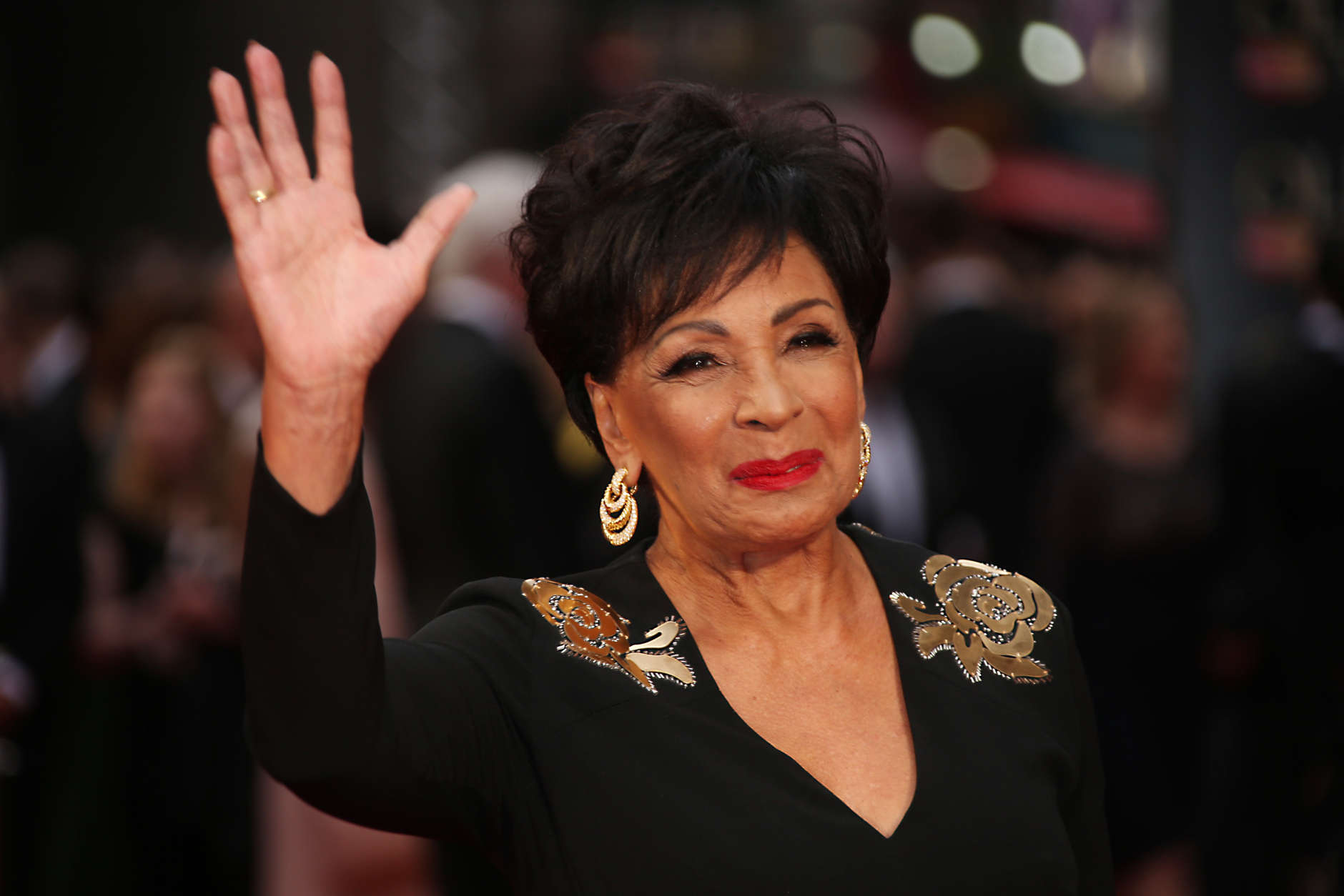 Dame Shirley Bassey poses for photographers upon arrival at the Olivier Awards in London, Sunday, April 3, 2016. (Photo by Joel Ryan/Invision/AP)